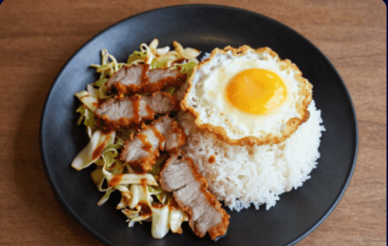 Stir-fried Cabbage with Fish Sauce over Rice with Fried Pork