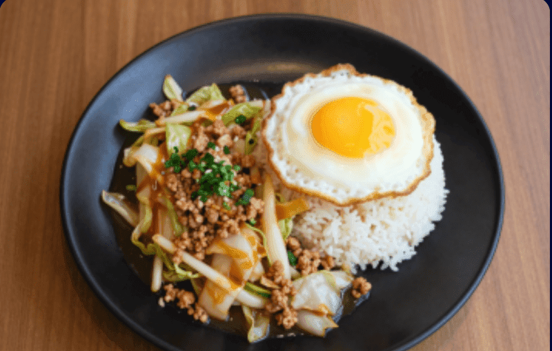 Stir-fried Cabbage with Fish Sauce over Rice with Minced Pork