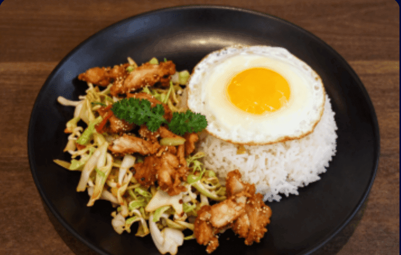 Stir-fried Cabbage with Fish Sauce over Rice with Crispy Chicken