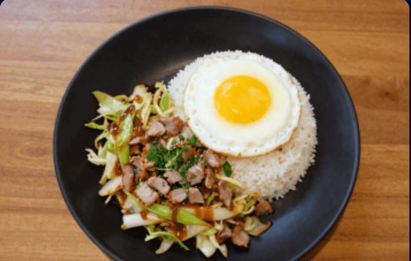 Stir-fried Cabbage with Fish Sauce over Rice with Sliced Pork